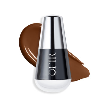 OFIR foundation bottle with a swatch of a deep warm nude-colored liquid foundation on a blank background