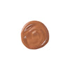 tan shade liquid swatch of tinted moisturizer, smooth texture with a glossy finish