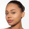 Model showcasing a natural but enhance dark brown brow design and color in a radiant natural makeup look.