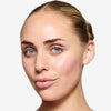 Model showcasing a fair shade of tinted moisturizer