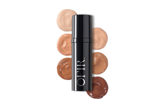 A sleek black bottle labeled "OFIR" is surrounded by swatches of foundation in a gradient of six shades from light to dark.