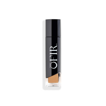 Elegant black cylindrical cosmetic bottle with a clear base, showcasing a beige liquid foundation inside, branded with "OFIR" in bold white lettering.