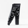 Two OFIR black primer tubes standing on white background