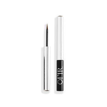 A sleek liquid eyeliner with a metallic cap and fine tip applicator designed for precision.