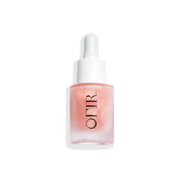 serum bottle with a frosted coral hue and a dropper cap, featuring the brand name "OFIR".
