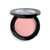 Open compact with soft pink powder encased in a sleek black container featuring a transparent lid.