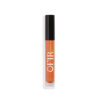 Clear tube of a burnt orange shade liquid lip gloss with a black cap
