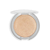 Compact highlighter with a shimmering golden finish, encased in a sleek round white container.