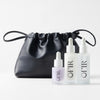 OFIR'S Skincare Bundle. Three OFIR skincare serums (Face Milk, Barrier Drops, and Bloom Serum in lilac)with a black pouch displayed on white background