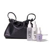 black drawstring bag with three skincare dropper bottles labeled "OFIR".