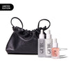 Limited edition set featuring a sleek black drawstring bag embossed with "OFIR" alongside three skincare serums in minimalist frosted bottles.