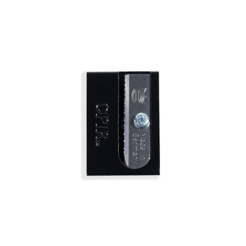 Black cosmetic pencil sharpener with a visible silver blade, designed for precise makeup application.