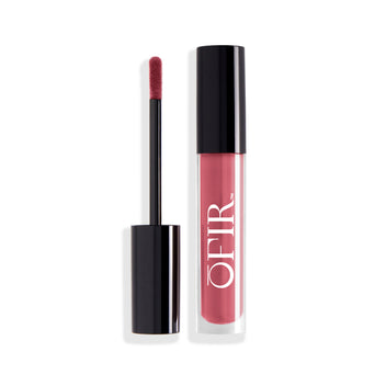 A sleek, black-capped tube of berry pink liquid lipstick is shown alongside its applicator wand