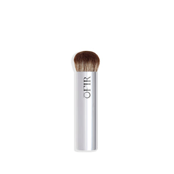 A sleek silver makeup brush with dense, rounded bristles designed for applying foundation or blending.