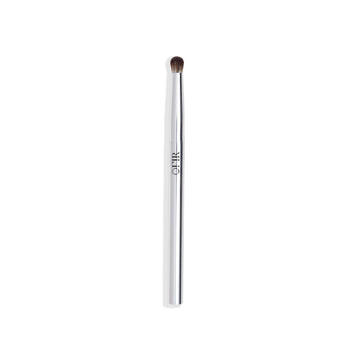 A sleek, silver-handled eye makeup brush with soft, rounded bristles.