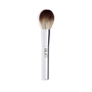 A makeup brush with a sleek silver handle and densely packed, soft bristles suitable for applying powders.