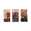 Three horizontal palettes of crushed eyeshadow featuring neutral and earth tones, including beige, brown, burgundy, and dark charcoal, arranged in rectangular compositions.