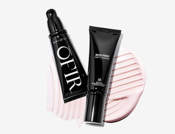 Two OFIR Skin Prep Matte Primer tubes positioned on a pink creamy texture swatch
