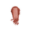 Matte rose-toned powder with a smooth texture, artfully scattered for visual appeal.