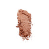 Crushed bronzer powder in a warm, shimmering copper shade on a white background.