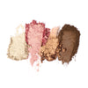 Four crushed earthy eyeshadow swatches, showcasing shimmer, texture, and pigment intensity