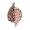 Two shades of crushed powder makeup, one light beige and the other deep brown, artistically arranged on a white background.