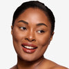 Full face make up look showcasing a burgundy lipstick 