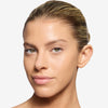 Close-up of model wearing OFIR Brow Tonic in shade Sumac, with natural, defined brows and a luminous skin finish