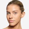 model showcasing a filled-in eyebrow with a blonde brow liner pencil