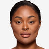 Full face make up look showcasing a 
brown lip liner