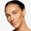 Full face make up look showcasing a light terracotta/ nude lipstick 