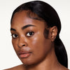 Full face make up look showcasing a 
black mascara