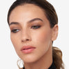 Model showcasing a brown eyeliner look