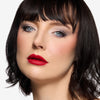 Model showcasing a red lipstick