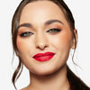 Model showcasing a bright red lipstick