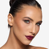 Model showcasing a wine shade lipstick
