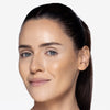 Model showcasing a light bronze makeup pigmentation 