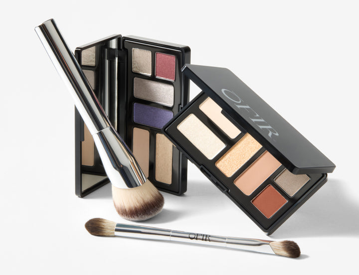 OFIR makeup products including  brushes, and two palettes on a white background