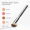 Angled makeup brush with soft, dense bristles displayed next to labeled swatches showing it works best with liquids and creams: foundation, cream blush, cream bronzer, serum, and primer