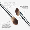 Close-up of a dual-ended silver makeup brush with soft two-tone synthetic bristles. Text on the image reads: “Aluminum tube handle – Textured for improved grip and durability and won’t rust or fade.” “Multi-use design – With compact end and plush end.” “Two-tone nano synthetic hair – Has a smooth fiber design ideal for all skin types'