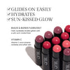 Promotional image for cream blush sticks featuring multiple shades arranged in a group. Text highlights product benefits: 'Glides on easily,' 'Hydrates,' 'Sun-kissed glow.' Additional features include buildable, lumi-matte finish and Vitamin C to revitalize skin. Set against a white background