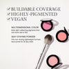 Blush compacts and a makeup brush with text highlighting features: buildable coverage, highly-pigmented, vegan, multidimensional color, and silky staying powder for all-day wear.