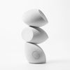 Three makeup sponges stacked vertically