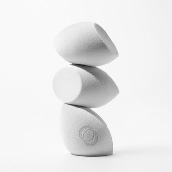 Three makeup sponges stacked vertically