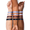 Three arms with different skin tones displaying cool eyeshadow swatches labeled: "Celestial", "Stardust", "Nebula", and "Dusk"