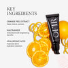 Key ingredients for a skincare product include orange peel extract for reducing redness, niacinamide for brightening benefits, and hyaluronic acid for improved hydration retention. The image features a black tube surrounded by orange slices and peels.