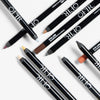 Assorted OFIR eyeliner pencils arranged on a white background in various shades