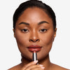 Full face make up look showcasing a burgundy lipstick 