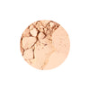 A close-up of a crushed, light beige pressed powder, suitable for setting makeup or achieving a matte finish.