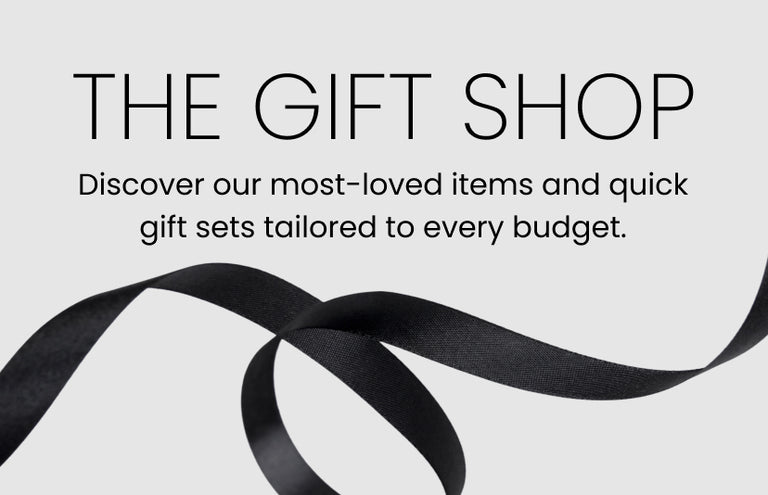 Promotional banner. Text reads: "THE GIFT SHOP. Discover our most-loved items and quick gift sets tailored to every budget"